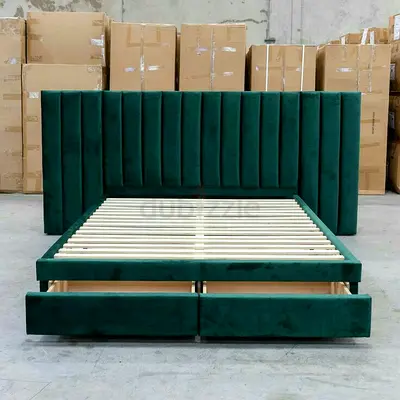 Green velvet bed frame with channel headboard and under-bed drawers