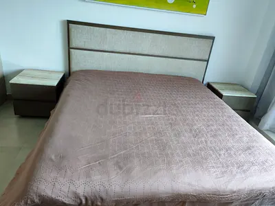 Bed frame with upholstered headboard and two bedside tables custom made  sell 1000 aed urgently