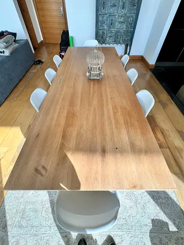Solid wood dining table with 8 Eames-style chairs