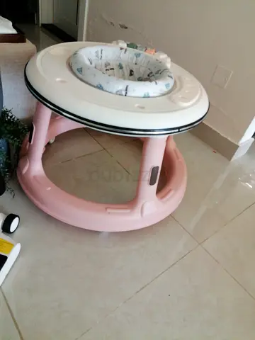 My pink baby walker with padded seat - lightly used