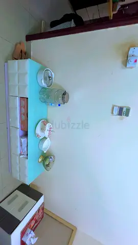 Rectangular turquoise glass-top coffee table - used, good condition