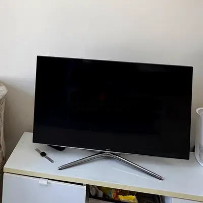 My flat-panel LED TV with stand — working condition