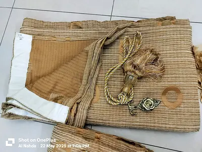 Beige striped curtains with tassel tiebacks