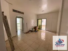 Two-bedroom apartment with a living room for annual rent in Al Majarrah - spacious - free dirt parki