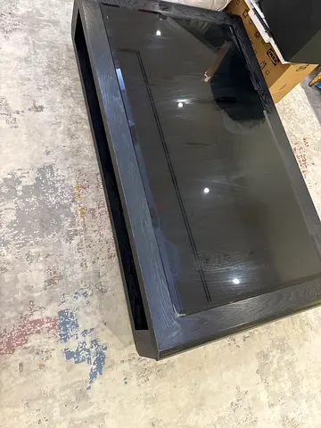 CLEARANCE Black glass-top coffee table with lower shelf
