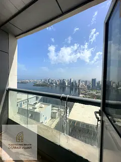 Three-bedroom apartment with a living room, a stunning view of Lake Khalid, a maid's room, and a