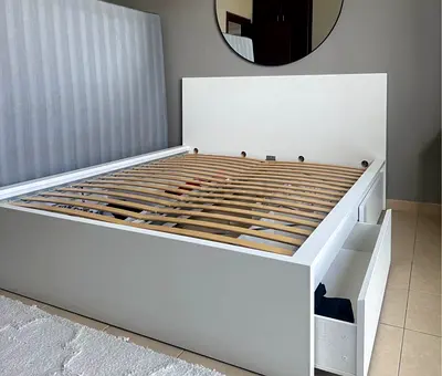 Ikea king size bed with mattress underneath 2 storage drawers available in perfect condition