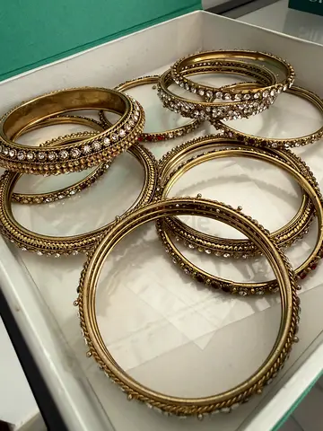 Gold-tone rhinestone bangle set (8 pieces)