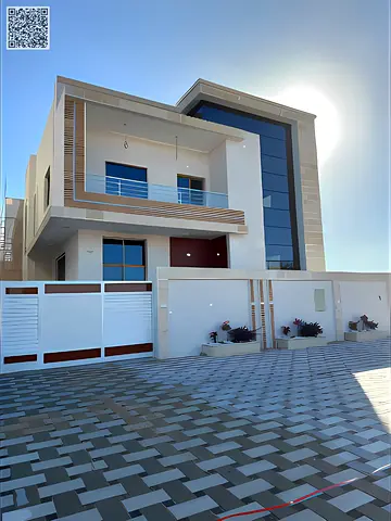 Villa for sale in the Al Helio area in Ajman. The villa is located on a main street and includes all registration fees. The villa has large master bed