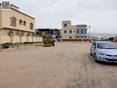 A 300-meter corner plot of land on 3 streets in the Al Yasmin area, prime location.