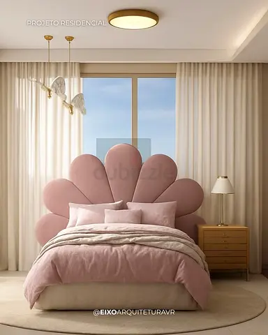 Pink flower-petal upholstered bed with scalloped headboard