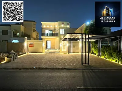 Luxury villa for sale in Al Muwaihat, Ajman, with a swimming pool, price includes electricity, water, and air conditioning.