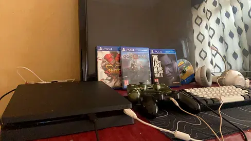 PS4 Slim with 2 DualShock Controllers and 3 Games And a screen and