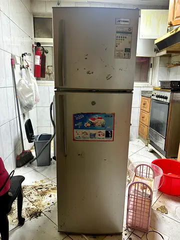 Used double-door refrigerator/freezer - selling as-is