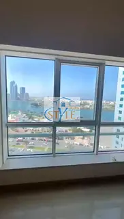 2-bedroom apartment with a living room for sale in Al Majaz 1 with a direct view of the Lake Cornich