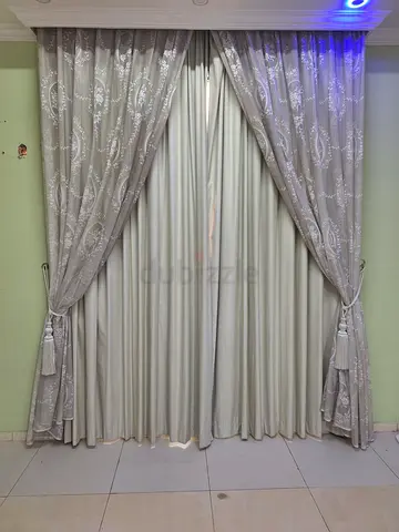 Beige patterned curtain set with blackout lining and tiebacks