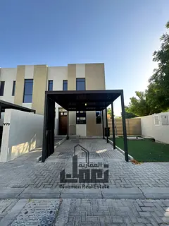 Own a premium corner townhouse in the heart of Nasma Residences, Sharjah. This modern property is de