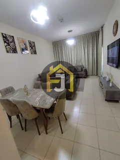 Two-bedroom apartment for sale in Ajman One Tower with city and garden view