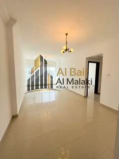One bedroom and living room with open view in Al Taawun for annual rent