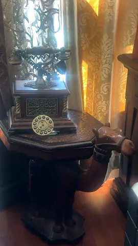 Hand-carved wooden camel side table — sturdy, good condition with telephone
