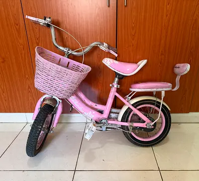 Pink kids bicycle with front basket (good condition)