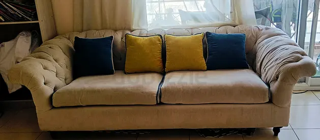 Elegant Beige Sofa with Colorful Cushions