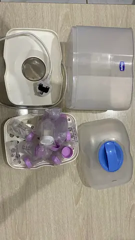 Chicco electric bottle sterilizer with assorted bottle parts