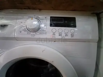 Used front-load washing machine — working