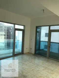 Two-bedroom apartment with a living room in Al Majaz 3, close to all services, with on-site amenitie