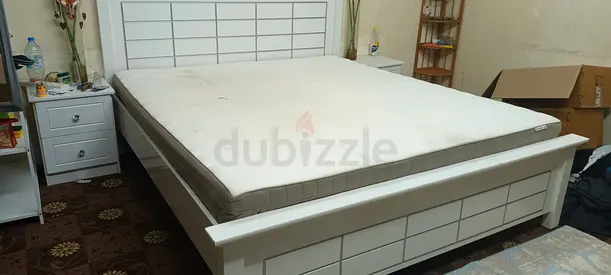 White wooden bed frame with mattress - used