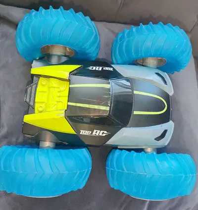 My remote-control stunt car with oversized blue wheels LOST (controller  PUMP)