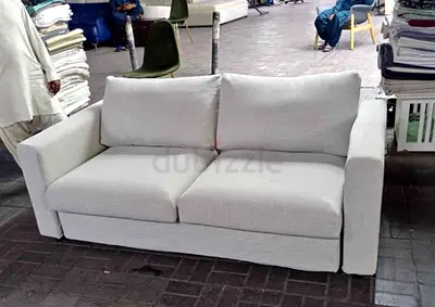 Light grey 2-seater fabric sofa bed
