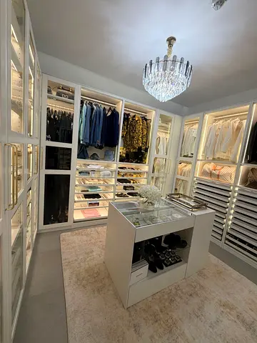 My custom walk-in wardrobe with island and built-in lighting