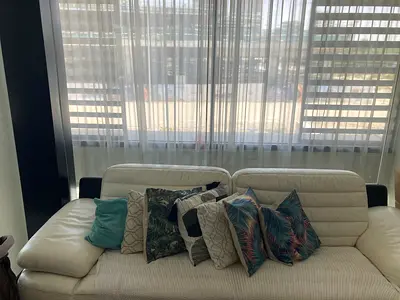 Stylish White Sofa with Decorative Pillows