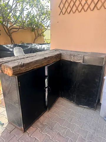 Reclaimed timber countertop with metal storage cabinets — outdoor kitchen island/bar