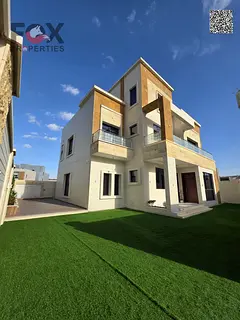Corner villa for sale in Al Zahia, Ajman, 6 master bedrooms, large setback, registration included, e