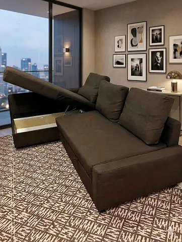 Dark brown convertible sofa bed with storage - good condition