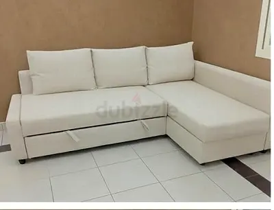 My beige L-shaped sofa with chaise and under-seat storage - good condition
