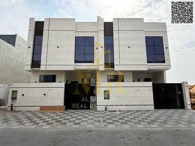 A stunning villa in Al Yasmin, featuring 4 master bedrooms, a majlis, a living room, and a rooftop terrace. Registration and ownership fees are includ
