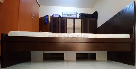 My dark wood bed frame with mattress - good condition