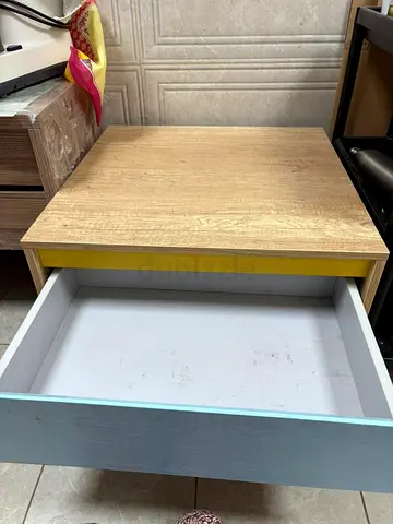 Small wooden nightstand with single drawer (light oak finish)