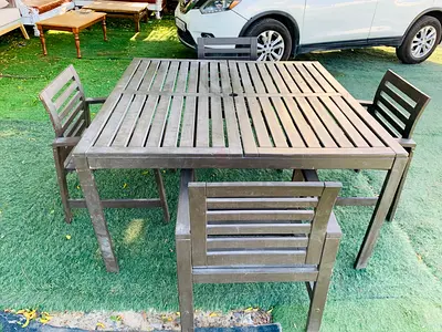 Selling my outdoor wooden dining set — square slatted table + 4 chairs