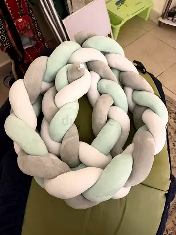 Grey braided crib bumper — not used