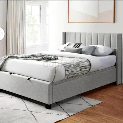 Light grey upholstered queen bed frame with storage (gently used)