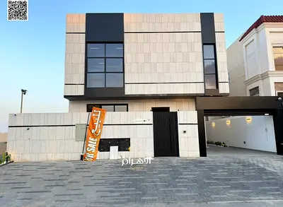 Luxury villa for sale in Al Bahia area, featuring two floors and a rooftop terrace. Modern design, spacious living areas, reception halls, and compreh