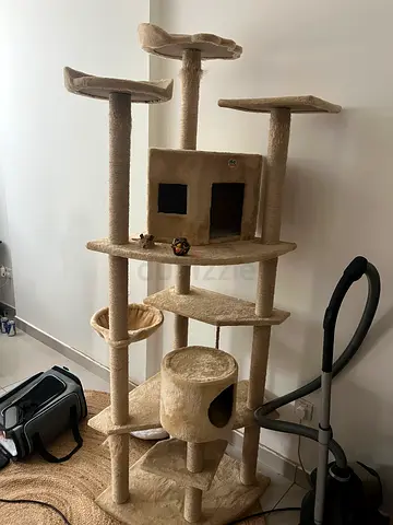Beige multi-level cat tree tower with condo, scratching posts and perches