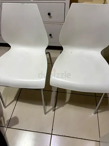 2 white chairs