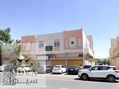 Residential–Commercial Building for Sale in Al Rawda 3 | Prime Corner Location