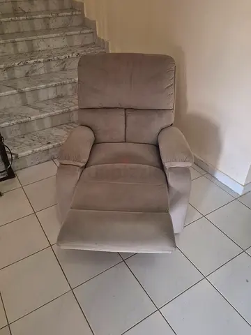 Grey reclining armchair — comfortable and well-kept