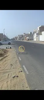 For sale: residential land in Al Hoshi, Sharjah, area 10,000 sq ft on an 18-meter street. Ground +1